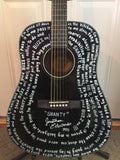 Black Fender guitar with lyrics